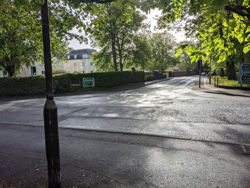 A picture of the bath road/sandford road junction showing lots of spare road space, but no through route for cyclists and no easy pedestrian crossing.