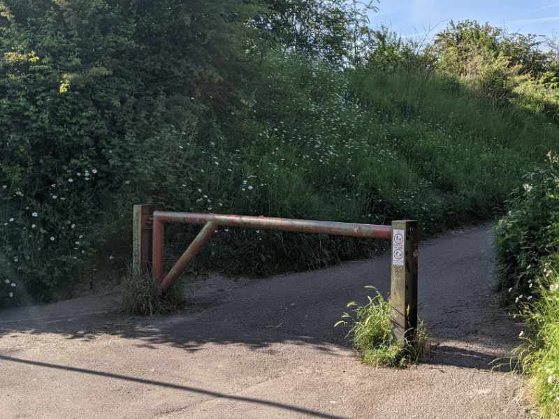 A metal barrier obstructs access to the end of the Honeybourne Line