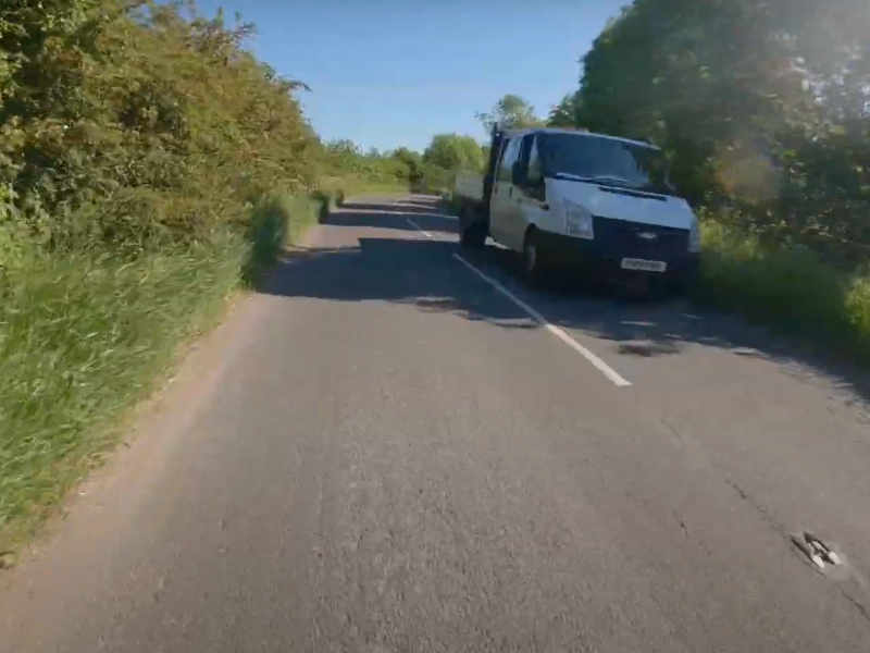 A still from cycling along Gotherington Lane near Bishops Cleeve on a section that should have a segregated cycle path built by Bovis Homes