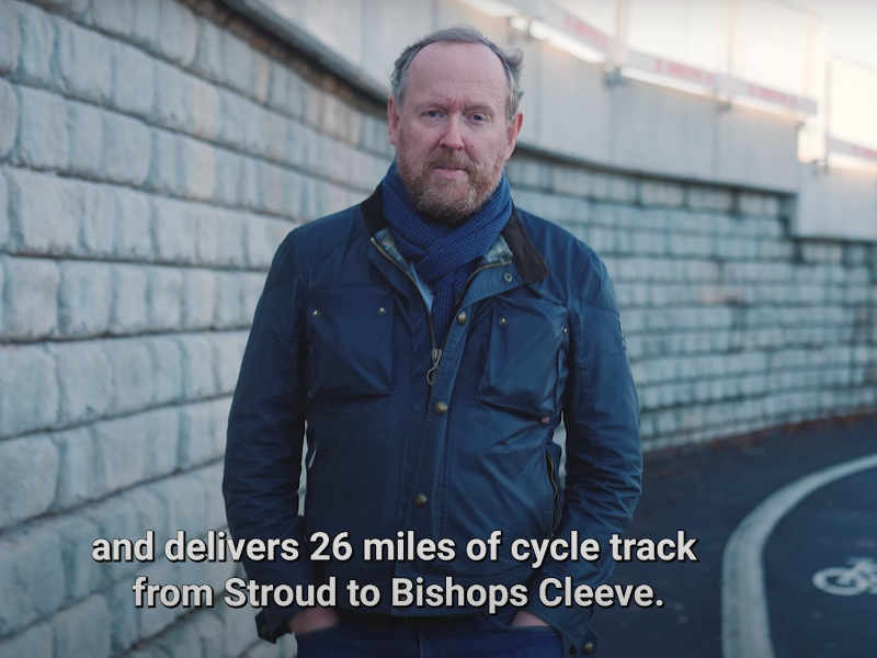 A screen clip from the GCC Gloucestershire budget video which shows a councillor promising 26 miles of cycle track