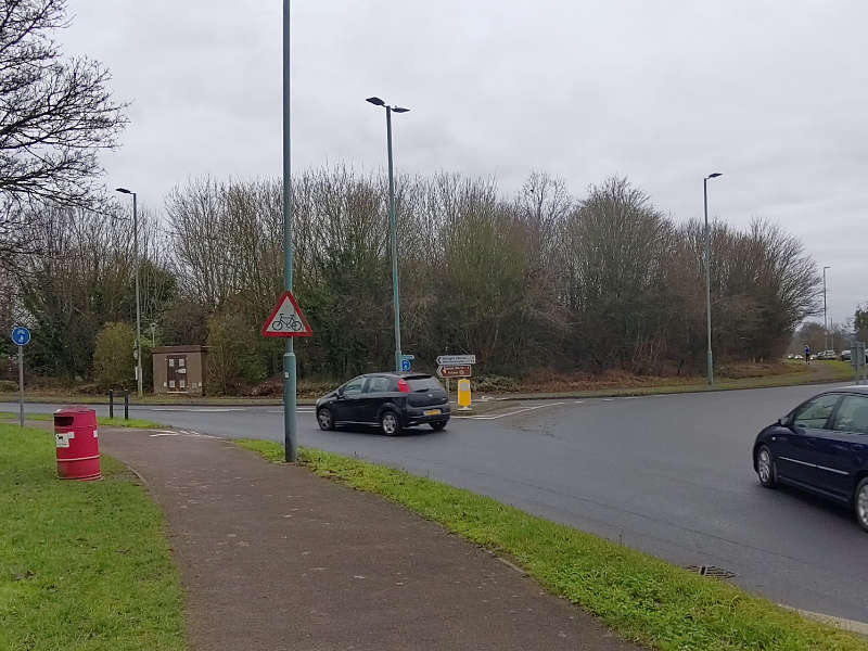 A typical no-priority crossing of the shared cycle path across a fast and wide junction exit from the A435 on the West side of Bishop's Cleeve , with inadequate refuge and turning arcs.